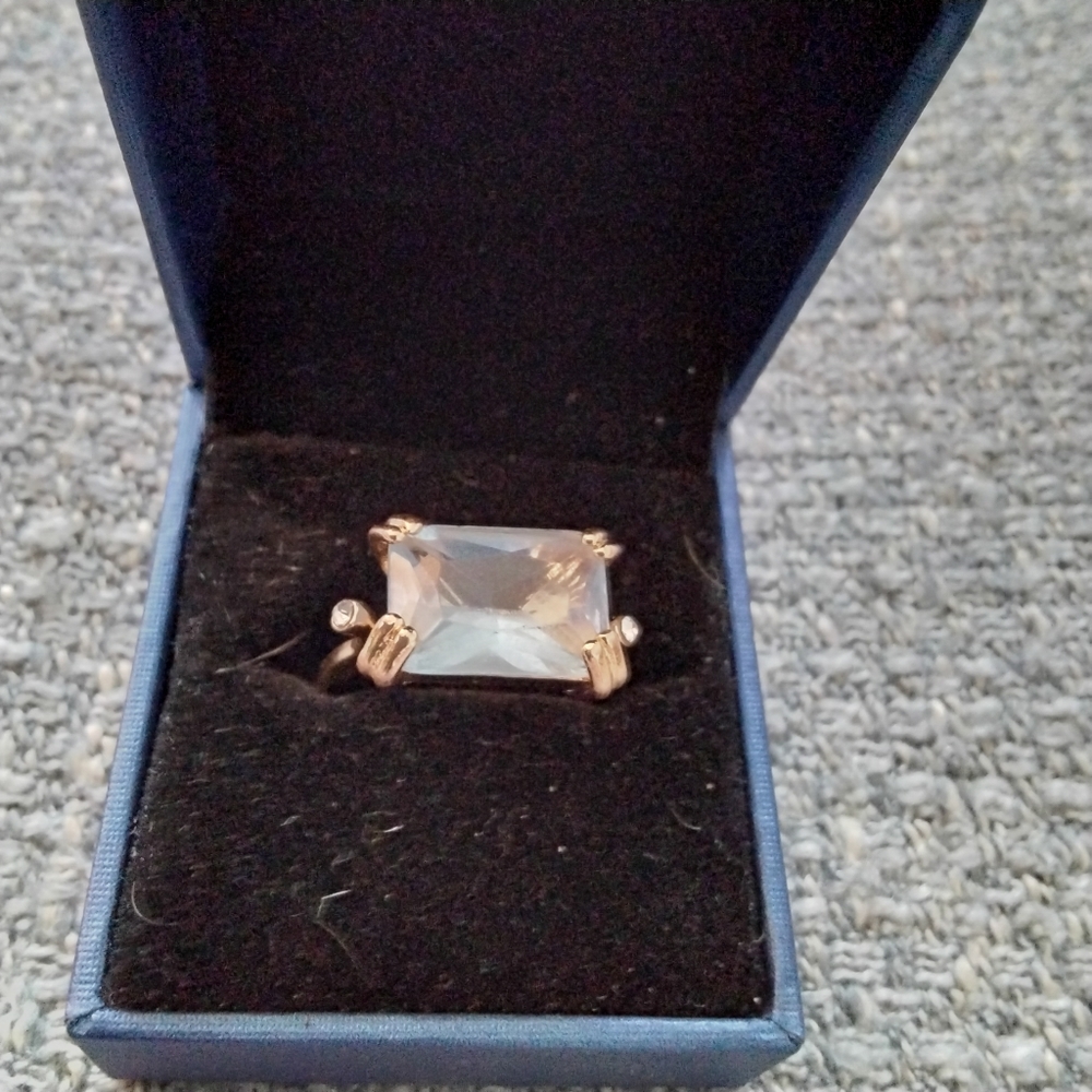 Large light blue gemstone gold color ring